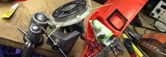 Vacuum cleaner repair parts and tools on a workbench in Spokane, WA